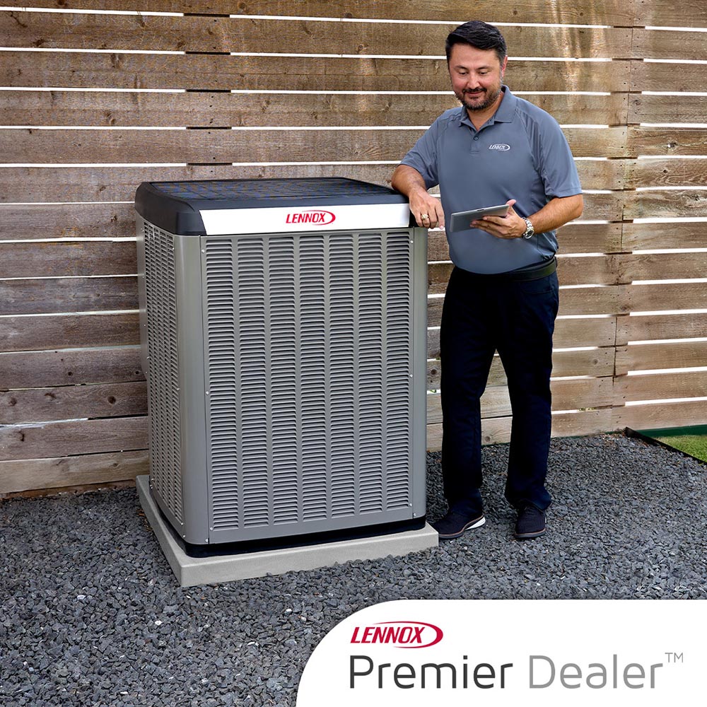 Lennox Premier Dealer technician with HVAC equipment